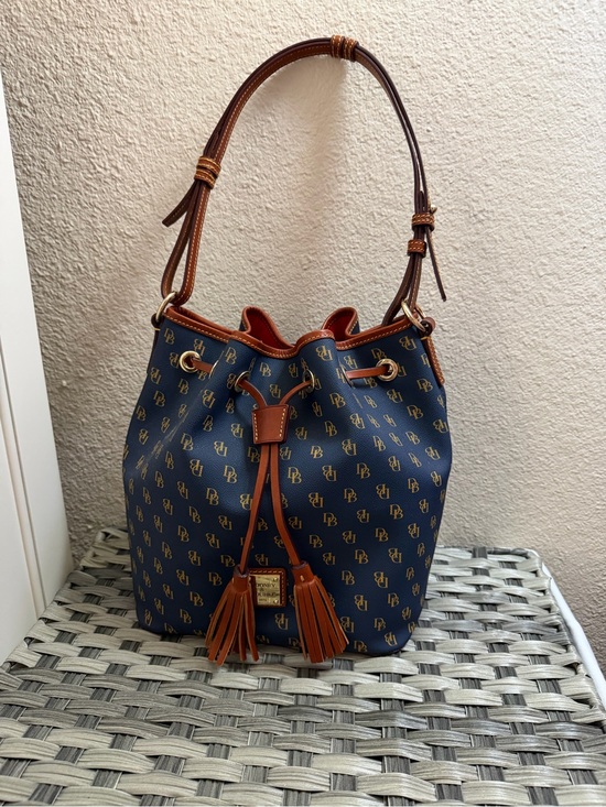 Dooney & Bourke Handbags - Dooney & Bourke Gretta Navy and Brown Monogram Drawstring Bucket Bag